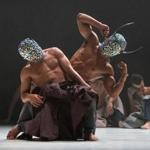 In part of the performance, dancers wear masks that glitter like disco balls and have knife-like horns. 