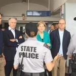 (l-r) Representative Seth Moulton, Rep. Richard Neal, Sen. Elizabeth Warren and Rep. Jim McGovern talk with Massachusetts State Police on duty in Puerto Rico. (Photo from Twitter account of Rep. Jim McGovern) 