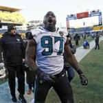 Jacksonville Jaguars defensive tackle Malik Jackson (97) celebrates as he leaves the field after a 45-42 win over the Pittsburgh Steelers in an NFL divisional football AFC playoff game in Pittsburgh, Sunday, Jan. 14, 2018. (AP Photo/Keith Srakocic)