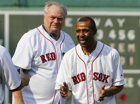 Former Boston Celtics player Tom Heinsohn, left, and Jo Jo White smile after they threw out the first pitches before a baseball game between the Boston Red Sox and the New York Yankees at Fenway Park in Boston on Wednesday, Sept. 2, 2015. Heinsohn and White are to be inducted into the Basketball Hall of Fame later this year. (AP Photo/Winslow Townson)
