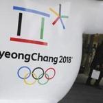 FILE - In this Thursday, Jan. 4, 2018, file photo, the official emblem of the 2018 Pyeongchang Olympic Winter Games is seen in downtown Seoul, South Korea. North Korea plans to send a spotlight-stealing delegation to next month?s Winter Olympics in the South Korean county of Pyeongchang. (AP Photo/Lee Jin-man, File)