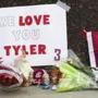 Items were left at a makeshift memorial for Washington State quarterback Tyler Hilinski outside Martin Stadium in Pullman, Wash., Wednesday.