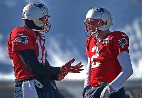 Foxborough, MA - 1/18/2018 - New England Patriots quarterback Tom Brady (12) on the practice field today after injury to his hand was reported yesterday. Brady is pictured with New England Patriots quarterback Brian Hoyer (2) at Patriots practice in Foxborough. - (Barry Chin/Globe Staff), Section: Sports, Reporter: Jim McBride, Topic: 11Patriots Practice, LOID: 8.4.682627802.
