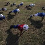 FILE ? Eight- and nine-year-old Pop Warner football players practice in Pflugerville, Texas, Aug. 13, 2015. Youths who began playing tackle football before the age of 12 had more behavioral and cognitive problems later in life than those who started playing after they turned 12, according to a study released by Boston University researchers on Sept. 19, 2017. (Tamir Kalifa/The New York Times)