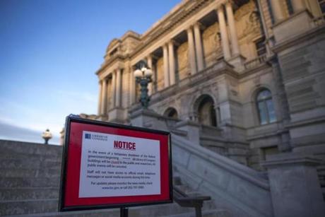 Mandatory Credit: Photo by SHAWN THEW/EPA-EFE/REX/Shutterstock (9327383as) A closed sign in front of the Library of Congress as the Senate continues work on ending the government shutdown in the US Capitol in Washington, DC, USA, 20 January 2018. Negotiations continue in the Senate today to resolve the government shutdown. Negotiations continue in the Senate to resolve the government shutdown, Washington, USA - 20 Jan 2018
