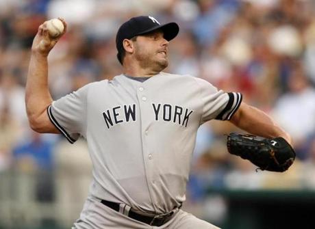 FILE - In this July 23, 2007, file photo, New York Yankees starting pitcher Roger Clemens throws to a Kansas City Royals batter during the first inning of a baseball game in Kansas City, Mo. Clemens and Barry Bonds fell short in elections to the baseball Hall of Fame. (AP Photo/Ed Zurga, File)
