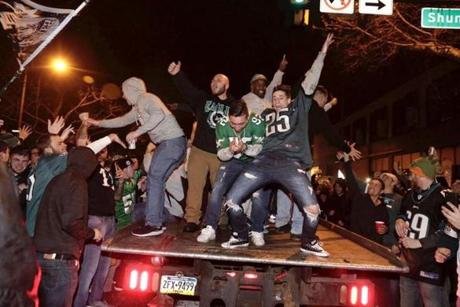 Eagles fans celebrate on south Broad St. near Shunk after their team defeated the Vikings in the NFC Championship game Sunday January 21, 2018. (Elizabeth Robertson/Philadelphia Inquirer)
