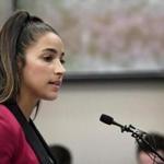 FILE- In this Jan. 19, 2018, file photo, Olympic gold medalist Aly Raisman gives her victim impact statement in Lansing, Mich., during the fourth day of sentencing for former sports doctor Larry Nassar, who pled guilty to multiple counts of sexual assault. (Dale G. Young/Detroit News via AP, File) 