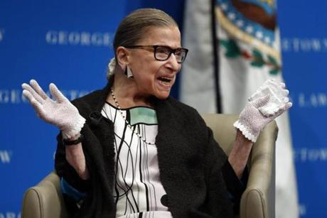 In this Sept. 20, 2017, file photo, U.S. Supreme Court Justice Ruth Bader Ginsburg reacts to applause as she is introduced by William Treanor, Dean and Executive Vice President of Georgetown University Law Center, at the Georgetown University Law Center campus in Washington. In different circumstances, Ginsburg might be on a valedictory tour in her final months on the Supreme Court. But in the era of Donald Trump, the 84-year-old Ginsburg is packing her schedule and sending signals she intends to keep her seat on the bench for years.(AP Photo/Carolyn Kaster, File)
