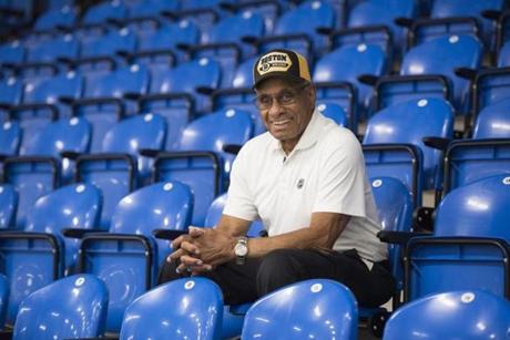 In this June 22, 2017, photo, Willie O'Ree, known best for being the first black player in the National Hockey League, poses for a photo in the Willie O'Ree Place in Fredericton, New Brunswick. O'Ree was honored in Boston on Wednesday, Jan. 17, 2018, on the 60th anniversary of the Bruins forward breaking the NHL's color barrier. (Stephen MacGillivray/The Canadian Press via AP)

