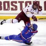 Chestnut Hill, MA - 1/27/2018 - (1st period) Boston College Eagles defenseman Michael Kim (4) levels Massachusetts-Lowell River Hawks forward Kenny Hausinger (10) with a open ice hit during the first period. Boston College hosts UMass-Lowell in Hockey East game at Conte Forum. - (Barry Chin/Globe Staff), Section: Sports, Reporter: Frank Dell'Apa, Topic: 28UMassLowell-BC, LOID: 8.4.745588610.