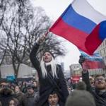 A protester waved the Russian flag during a rally in Moscow on Sunday against the Central Election Commission?s decision to ban Alexey Navalny?s presidential candidacy.
