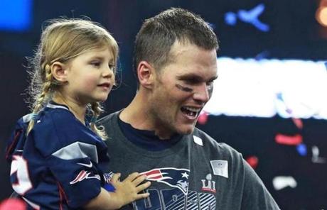 Patriots quarterback Tom Brady held his daughter Vivian on the podium after last year?s Super Bowl victory.
