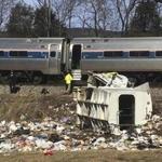 Emergency personnel worked at the scene of a train crash involving a garbage truck in Crozet, Va. on Wednesday.