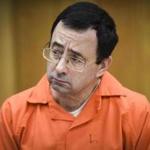 Larry Nassar listened to a victim statement Friday in Eaton County Circuit Court in Charlotte, Mich.