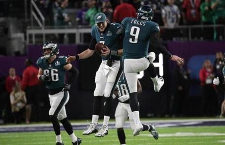 SUPER BOWL SLIDER4 Minneapolis, MN - 2/4/2018 - Nick Foles celebrates with backup quarterback Nate Sudfeld after Foles touchdown during 2nd quarter of Super Bowl LII. The New England Patriots play the Philadelphia Eagles in Super Bowl LII at US Bank Stadium in Minneapolis on Feb. 4, 2018. (Barry Chin/Globe staff

