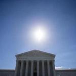 (FILES) This file photo taken on June 25, 2017 shows The sun shining above the U.S. Supreme Court June 26, 2017 in Washington, DC. Buttoned-up justices of the top US court on Wednesday heard arguments in a simple noise complaint case involving scantily clad women and lap dances but which has weighty legal implications. / AFP PHOTO / Eric ThayerERIC THAYER/AFP/Getty Images