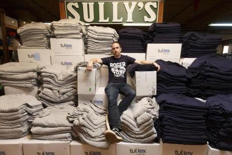 2/5/18 - Peabody, MA - Chris Wrenn, cq, is the founder of Sully's clothing company - who made the iconic Roger That shirt that Tom Brady held on the duck boat last year. This year, he has piles of unprinted T-shirts that he'd going to try to sell back to the distributor as a way to recoup his spent costs. Story by Janelle Nanos/Globe Staff. Topic: 06SuperBowlEconomics. Photo by Dina Rudick/Globe Staff.

