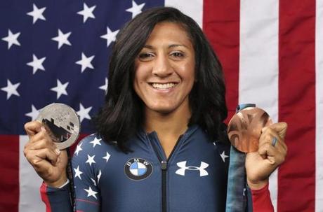 FILE - In this Sept. 25, 2017, file photo, United States bobsledder Elana Meyers Taylor poses for a portrait with her Olympic medals at the 2017 Team USA Media Summit in Park City, Utah. The progression is obvious. Bronze in 2010. Silver in 2014. That would mean Meyers Taylor has one Olympic stone left unturned, and after a very challenging year the U.S. women's bobsledder is starting her final preparations to win the gold that slipped away at the Sochi Games four years ago. (AP Photo/Rick Bowmer, File)
