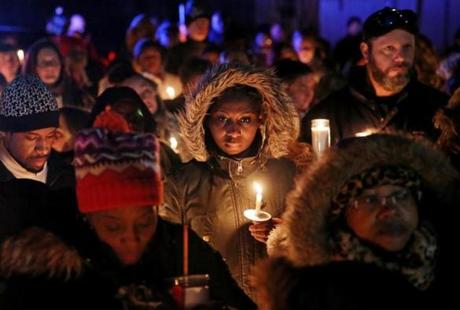 Brockton, MA- February 08, 2018: Community members gathered for a vigil in memory of 8-year-old Edson Brito and 5-year-old Lason Brito outside their home in Brockton, MA on February 08, 2018. Members of the community are gathered to remember the lives of the two children who were fatally stabbed and found in a Prospect Street home in Brockton on Monday. One of the last times anyone saw Latarsha L. Sanders' two little boys alive,she allegedly vowed to kill someone so that she could obtain a human heart to give to her dying father. The 43-year-old allegedly showed up ranting at her mother?s home on Saturday afternoon with two of her sons, 8-year-old Edson ?Marlon? Brito and 5-year-old Lason Brito, in tow. She was rambling about human sacrifice, her mother later told police. Sanders said her boys were sick, and she was taking them to the hospital. She left, and she stopped answering her mother?s phone calls. (Craig F. Walker/Globe Staff) section: metro reporter:
