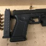 Police recovered a loaded Glock 22 .40-caliber pistol with a large-capacity feeding device from two men in Mattapan Friday morning.