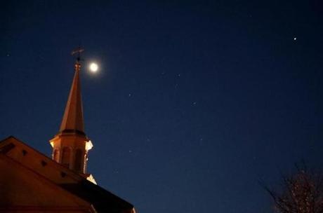 The First Congregational Church in Hanover under the moon, planets, and stars before sunrise looking south.
