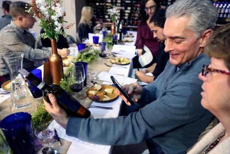 Chuck Tortorello, of Medway, took a picture of a bottle of 2015 Duca di Cardino Rosso di Montepulciano during a wine class at VINOvations in Sharon recently.
