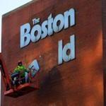 04herald - Workmen take down the Boston Herald sign at the newspaper building early Wednesday morning in Boston. (Vyto Starinskas, Special to the Boston Globe)
