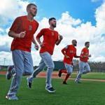 Fort Myers, FL 2/14/2018: The first official day of Spring Training for Red Sox pitchers and catchers was today at the Player Development Complex at Jet Blue Park, and the top four pitchers in the Boston rotation (left to right) Chris Sale, Rick Porcello, David Price and Drew Pomeranz were running together with green grass below them and puffy whites clouds and blue skies above them. (Jim Davis/Globe Staff)