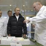 FILE - In this Monday, Sept. 20, 2010 file photo, businessman Yevgeny Prigozhin, right, shows Russian President Vladimir Putin, second right, around his factory which produces school means, outside St. Petersburg, Russia. On Friday Feb. 16, 2018, Yevgeny Prigozhin along with 12 other Russians and three Russian organizations, were charged by the U.S. government as part of a vast and wide-ranging effort to sway political opinion during the 2016 U.S. presidential election.(Alexei Druzhinin, Sputnik, Kremlin Pool Photo via AP, File)