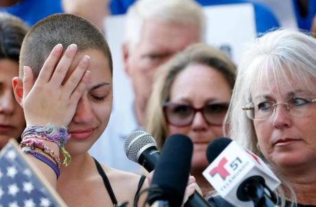 TOPSHOT - Marjory Stoneman Douglas High School student Emma Gonzalez reacts during her speech at a rally for gun control at the Broward County Federal Courthouse in Fort Lauderdale, Florida on February 17, 2018. A student survivor of the Parkland school shooting called out US President Donald Trump on Saturday over his ties to the powerful National Rifle Association, in a poignant address to an anti-gun rally in Florida. 