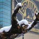 Boston-02/11/2017 The statue of Bruins Bobby Orr outside TD Garden is covered in snow after the overnight snowstorm. The statue depicts Orr's 1970 Stanley Cup winning overtime goal. JohnTlumacki/Globe Staff (metro)