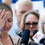 TOPSHOT - Marjory Stoneman Douglas High School student Emma Gonzalez reacts during her speech at a rally for gun control at the Broward County Federal Courthouse in Fort Lauderdale, Florida on February 17, 2018. A student survivor of the Parkland school shooting called out US President Donald Trump on Saturday over his ties to the powerful National Rifle Association, in a poignant address to an anti-gun rally in Florida. 