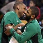 Boston MA 12/22/17 Boston Celtics Kyrie Irving and Al Horford on the bench reacting to teammate Terry Rozier's slam dunk against the Chicago Bulls during fourth quarter action at TD Gardenl. (Matthew J. Lee/Globe staff) topic reporter: 
