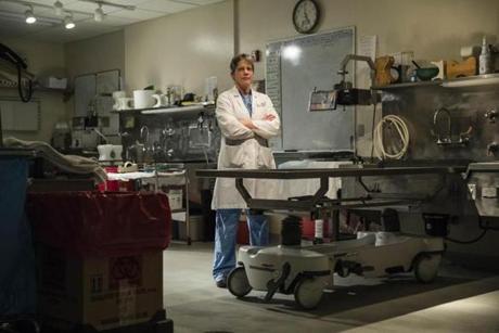 Dr. Jennie Duval, New Hampshire's chief medical examiner, stood in her lab in Concord, NH.
