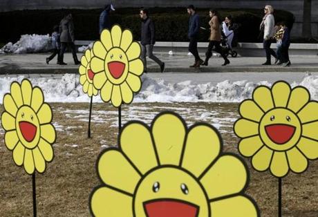 Boston, MA -- 2/19/2018 - Visitors to the Museum of Fine Art are framed by an installation piece outside of the museum by artist Takashi Murakami on a warm day in Boston. (Jessica Rinaldi/Globe Staff) Topic: Reporter: 
