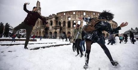 A snowball fight broke out in front of the Colosseum in Rome.  

