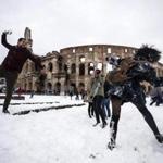 A snowball fight broke out in front of the Colosseum in Rome.  