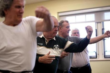 Plymouth, MA - 2/16/2018 - L to R: Paul MacDonald, 70, Bruce Goodwin, 73, Stuart Hudson, 71, and John Justice, 75, all Plymouth residents taking part in Uechi-Ryu Karate class at town's Center for Active Living. Towns are trying to attract baby boomers and younger seniors with martial arts and other such programs. - (Barry Chin/Globe Staff), Section: Business, Reporter: Unknown, Topic: xxseniorstigma, LOID: 8.4.1008843942.
