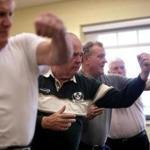 Plymouth, MA - 2/16/2018 - L to R: Paul MacDonald, 70, Bruce Goodwin, 73, Stuart Hudson, 71, and John Justice, 75, all Plymouth residents taking part in Uechi-Ryu Karate class at town's Center for Active Living. Towns are trying to attract baby boomers and younger seniors with martial arts and other such programs. - (Barry Chin/Globe Staff), Section: Business, Reporter: Unknown, Topic: xxseniorstigma, LOID: 8.4.1008843942.