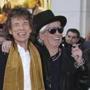 FILE - In this April 4, 2016 file photo, Mick Jagger, left, and Keith Richards pose for photographers upon arrival at the Rolling Stones Exhibitionism preview in London. Richards says he regrets saying Mick Jagger needed a vasectomy after recently having his eighth child. In a story posted Wednesday morning, The Wall Street Journal Magazine reported that Richards said ?it?s time for the snip _ you can?t be a father at that age. Those poor kids!? Richards says ?I deeply regret the comments I made about Mick? in a statement released Wednesday afternoon. He says his words ?were completely out of line? and that he apologized to the Rolling Stone frontman in person. (Photo by Joel Ryan/Invision/AP, File)