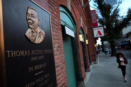 A plaque honoring Tom Yawkey at Fenway Park was seen on Yawkey Way.
