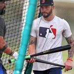 Fort Myers, FL 2/13/2018: Red Sox catcher Blake Swihart (right) is pictured as he heads into a batting cage to hit as teamate and fellow backstop Sandy Leon (left) heads out during a batting practice session at the Player Development Complex at Jet Blue Park. (Jim Davis/Globe Staff)