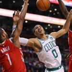 Boston-12/28/2017 Boston Celtics vs Houston Rockets- Celtics Jayson Tatum is fouled in the 2nd qtr driving for the basket between Rockets Trevor Ariza(l) and James Harden. John Tlumacki/Globe staff (sports)