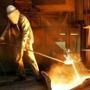 A steel worker took a sample at the blast furnace of ThyssenKrupp steel company in Duisburg, western Germany. 