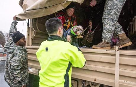 A couple dogs were evacuated from a flooded vehicle in Winthrop. 
