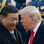 FILE - In this Nov. 9, 2017, file photo, U.S. President Donald Trump, right, chats with Chinese President Xi Jinping during a welcome ceremony at the Great Hall of the People in Beijing. Seeking China?s help on isolating North Korea through economic sanctions, Trump backed off a threat to label China a currency manipulator. He was off-and-on conciliatory on trade during an extended visit to Asia in November, and China announced it would lift restrictions on foreign investment in its banks and other financial institutions. (AP Photo/Andy Wong, File)