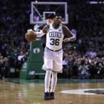 Boston Celtics guard Marcus Smart (36) dribbles during the first quarter of an NBA basketball game in Boston, Wednesday, Feb. 28, 2018. (AP Photo/Charles Krupa)