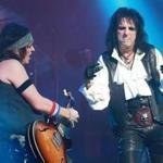 Alice Cooper (right) jamming with bandmate Ryan Roxie while in concert at the Wang Theatre.