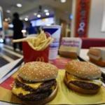 A McDonald's Quarter Pounder (right) and a Double Quarter Pound burger were shown with the new fresh beef on Tuesday.